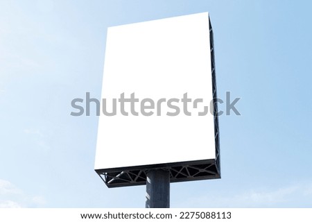 Outdoor pole billboard on blue sky background with mock up white screen and clipping path Royalty-Free Stock Photo #2275088113