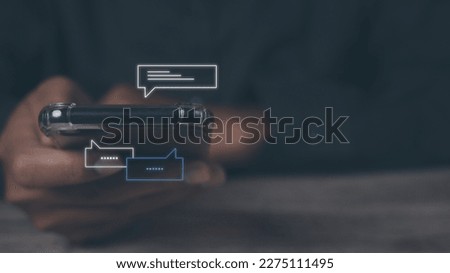 Young man using smartphone with social media to interactions icon on internet post. Data and marketing concept. Social media and digital online on mobile phone. Royalty-Free Stock Photo #2275111495