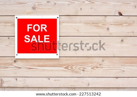 For Sale Red White Sign on Timber Wall