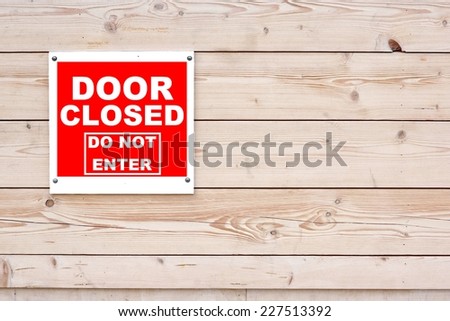 DOOR CLOSED DO NOT ENTER Red White Sign Red White Sign on Timber Wall Background