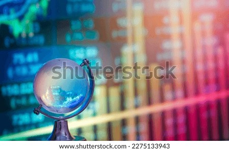 World economic and stock concept.Crystal globe with index stock background. Royalty-Free Stock Photo #2275133943
