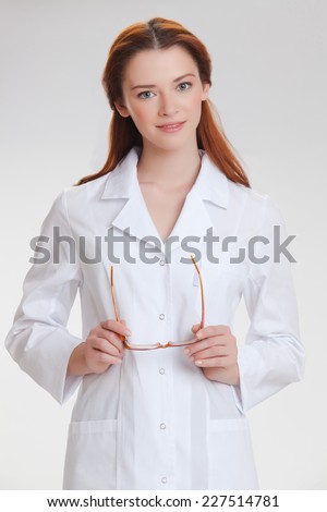 Portrait of a young girl in white  medical lab coat