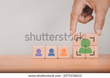 senior businessman's hand complete crop icon, people inside on wood cube for Buyer persona and target customer, recruitment, leader concept. Buyer or customer psychology profile or characteristics Royalty-Free Stock Photo #2275150613