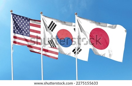 American flag with Japan flag and South Korea flag on cloudy sky. waving in the sky Royalty-Free Stock Photo #2275155633