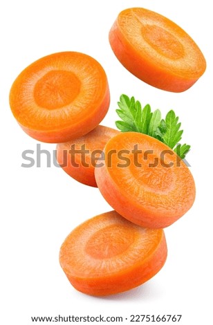 Carrot slice isolated. Carrots with parsley flying on white background. Perfect retouched carrot slices isolate. Full depth of field.