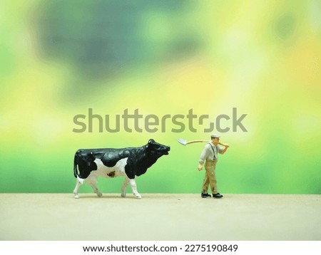 Mini toy at table with blurred background. Royalty-Free Stock Photo #2275190849