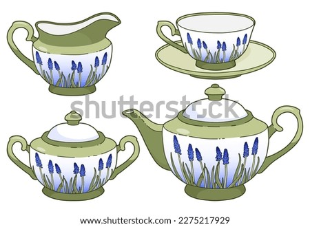 Elegant tea set isolated on white. Beautiful crockery decorated with blue flowers. Green tableware.