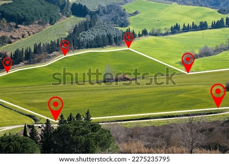 Building lot on hilly land - Land plot management - Real estate concept with a vacant land on a green field with trees available for building construction and housing Royalty-Free Stock Photo #2275235795