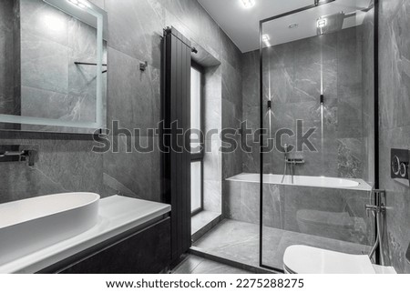 Modern furnished bathroom dark grey interior design with granite tiles Royalty-Free Stock Photo #2275288275