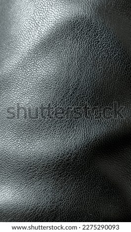 close-up texture of black leather Royalty-Free Stock Photo #2275290093