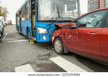 Head-on collision of a car and a bus at a pedestrian crossing. Car accident. Traffic accident.                                 Royalty-Free Stock Photo #2275294983