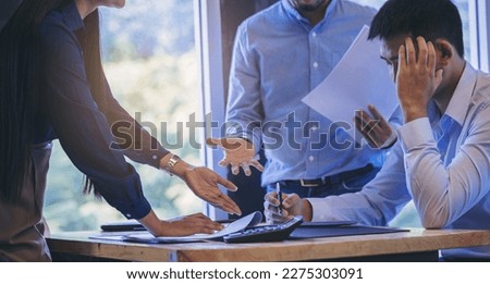 Serious woman boss and colleague scolding worker employee for bad business result with thumb down in meeting. Royalty-Free Stock Photo #2275303091