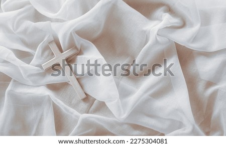 Good Friday and Holy week concept - A religious cross on white fabric background. Royalty-Free Stock Photo #2275304081