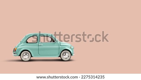 Model retro toy car on pink peach background. Miniature car with copy space Royalty-Free Stock Photo #2275314235