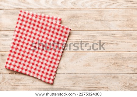 top view with red empty kitchen napkin isolated on table background. Folded cloth for mockup with copy space, Flat lay. Minimal style. Royalty-Free Stock Photo #2275324303
