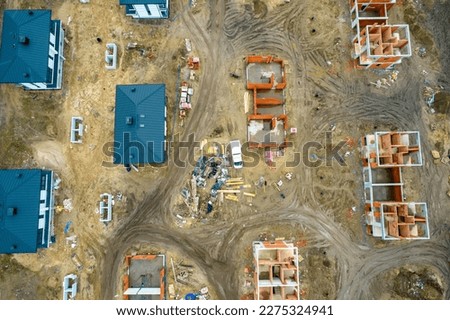 Construction of a single-family housing development, top view. Drone photo. 
