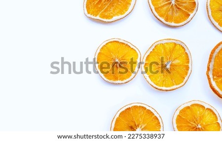 Dried Orange slices on white background. Royalty-Free Stock Photo #2275338937
