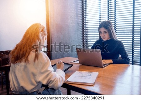 Teenage college students doing research assignments in the private study room