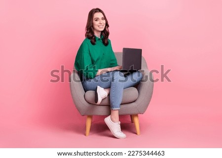 Full length photo of charming positive lady dressed green blouse sitting sofa typing emails modern device isolated pink color background Royalty-Free Stock Photo #2275344463