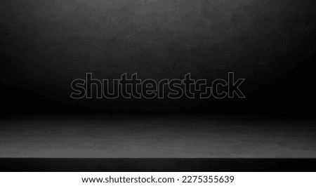 Empty Dark grey cement wall studio background with soft light and floor perspective well display production and free space for text presentation on backdrop 