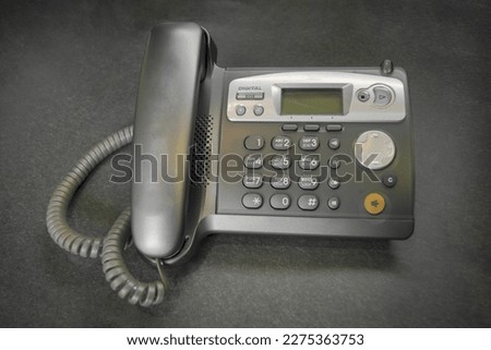 DECT radiotelephone Base station. Dect cordless phone wireless phone, radiotelephone, radio phone on grey background. Royalty-Free Stock Photo #2275363753