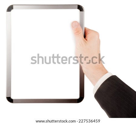 Businessman in suit holding an empty whiteboard (magnetic board) isolated on white