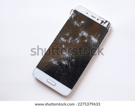 Broken smartphone screen isolated on white background,cracked smartphone screen
