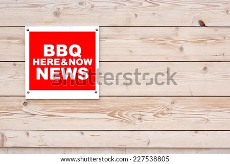 BBQ NEWS HERE AND NOW Red White Sign on Timber Wall Background