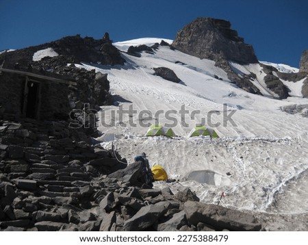 Camping in the Snow, Tents at Camp Muir, Climbing Mount Rainier Royalty-Free Stock Photo #2275388479