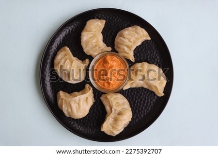 Momos or dumplings, nepali traditional food Royalty-Free Stock Photo #2275392707