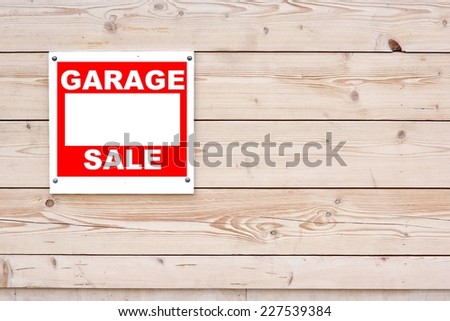Garage Sale Sign on Natural Wood Wall