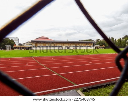 green ball field and national standard running track owned by Yogyakarta State University