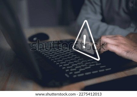 Computer hack warning,System hacked warning alert on notebook (Laptop),cyber security concept,The danger of malware viruses,ransomware virus,triangle caution warning sign for notification error