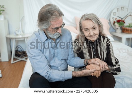 Senior husband and wife holding hands to encourage,eternal love, trustworthy harmonic relations between older spouses concept. Royalty-Free Stock Photo #2275420505