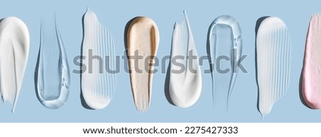 pattern cosmetic smears cream texture on pastel background Royalty-Free Stock Photo #2275427333