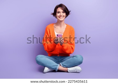 Full body photo advert of millennial funky optimist user gadget review woman promoter hold new apple smartphone isolated on violet color background