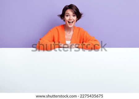 Photo of young shocked overjoyed lady stay folded arms on huge empty space banner cheap brand offer proposition isolated on purple color background