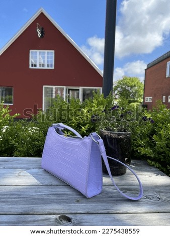 A beautiful handbag against the background of the wonderful architecture of Denmark