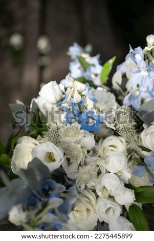 Bridal bouquet. Wedding. Beautiful bouquet of white, blue flowers and greenery. Fresh flowers bouquet. Wedding day.
