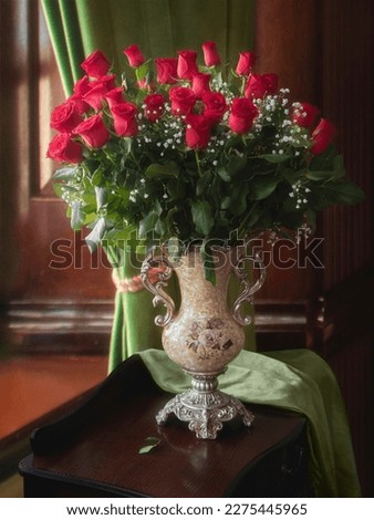 Still life with bouquet of red roses