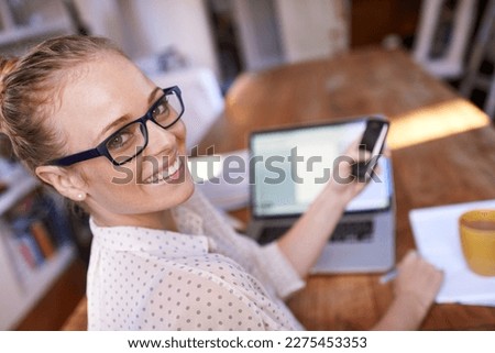 I love working from home. Portrait of a beautiful young woman working from home.