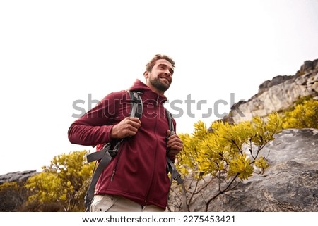 Passionate about hiking. a young man enjoying a hike through the mountains. Royalty-Free Stock Photo #2275453421