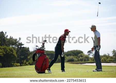 Frustration is part of the game. two men playing a game of golf and looking frustrated. Royalty-Free Stock Photo #2275453611