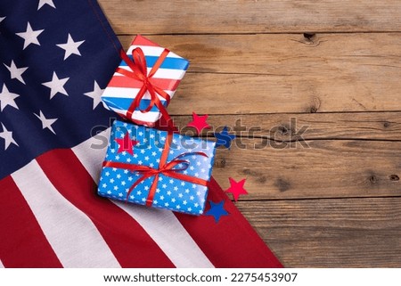 USA independence day, celebration, patriotism and holidays concept - close-up with candy flag and stars at 4th of july party from above on wooden background. High quality photo