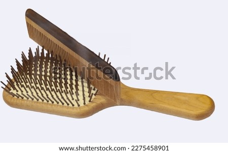 brush and comb on white background