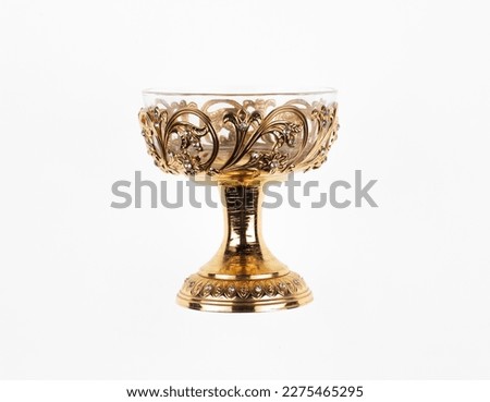ancient golden wine glass isolated on white background Royalty-Free Stock Photo #2275465295