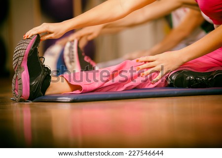 stretching pilate exercises in fitness studio Royalty-Free Stock Photo #227546644