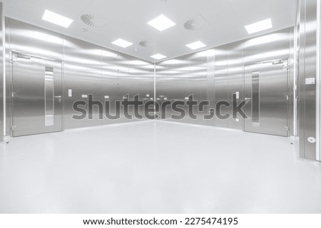 Stainless steel cleanroom with door and LED lighting Royalty-Free Stock Photo #2275474195