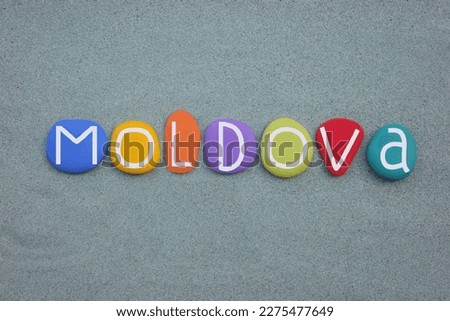 Moldova, officially the Republic of Moldova, souvenir composed with multi colored stone letters over green sand