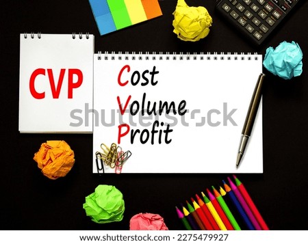 CVP cost volume profit symbol. Concept words CVP cost volume profit on white note on beautiful black background. Pencil and pen. Calculator. Business and CVP cost volume profit concept. Copy space.